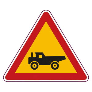 Construction vehicles crossing (from right) road sign